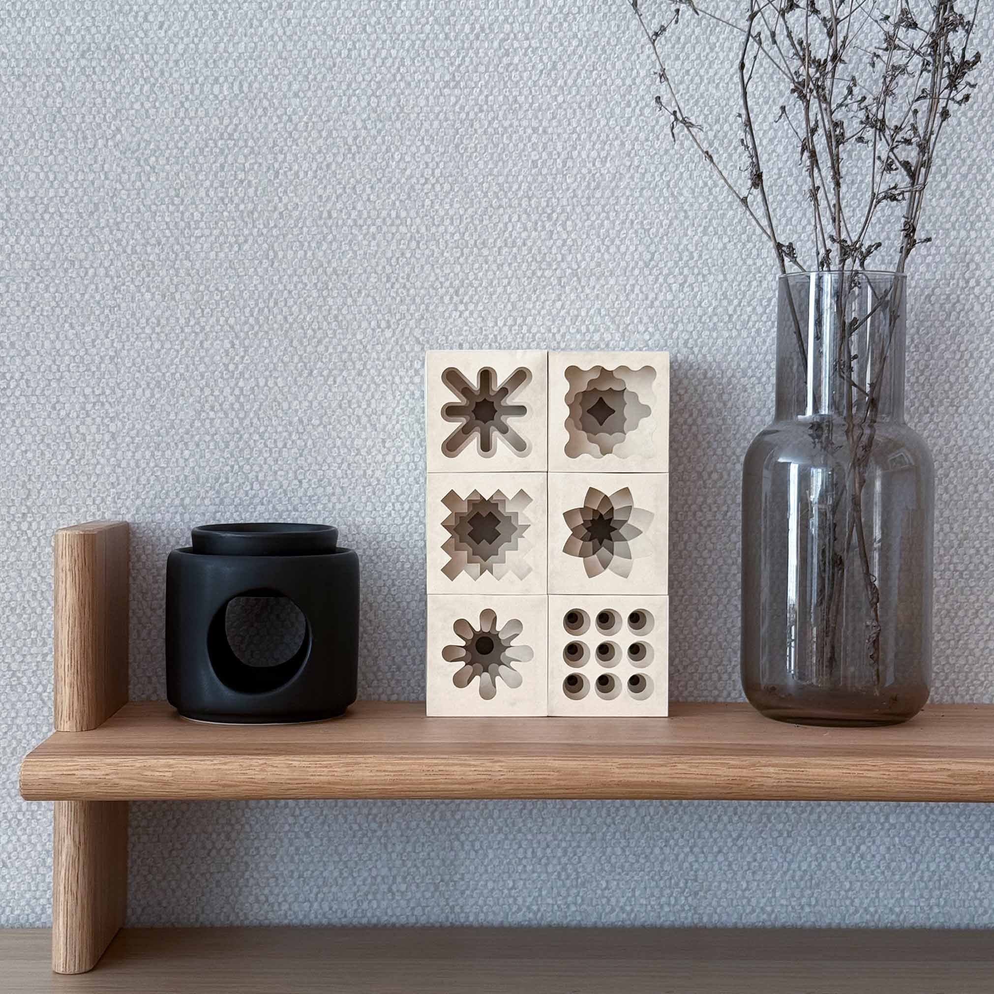 Expert-level geometric 3D paper sculpture on a shelf, modern interior accent